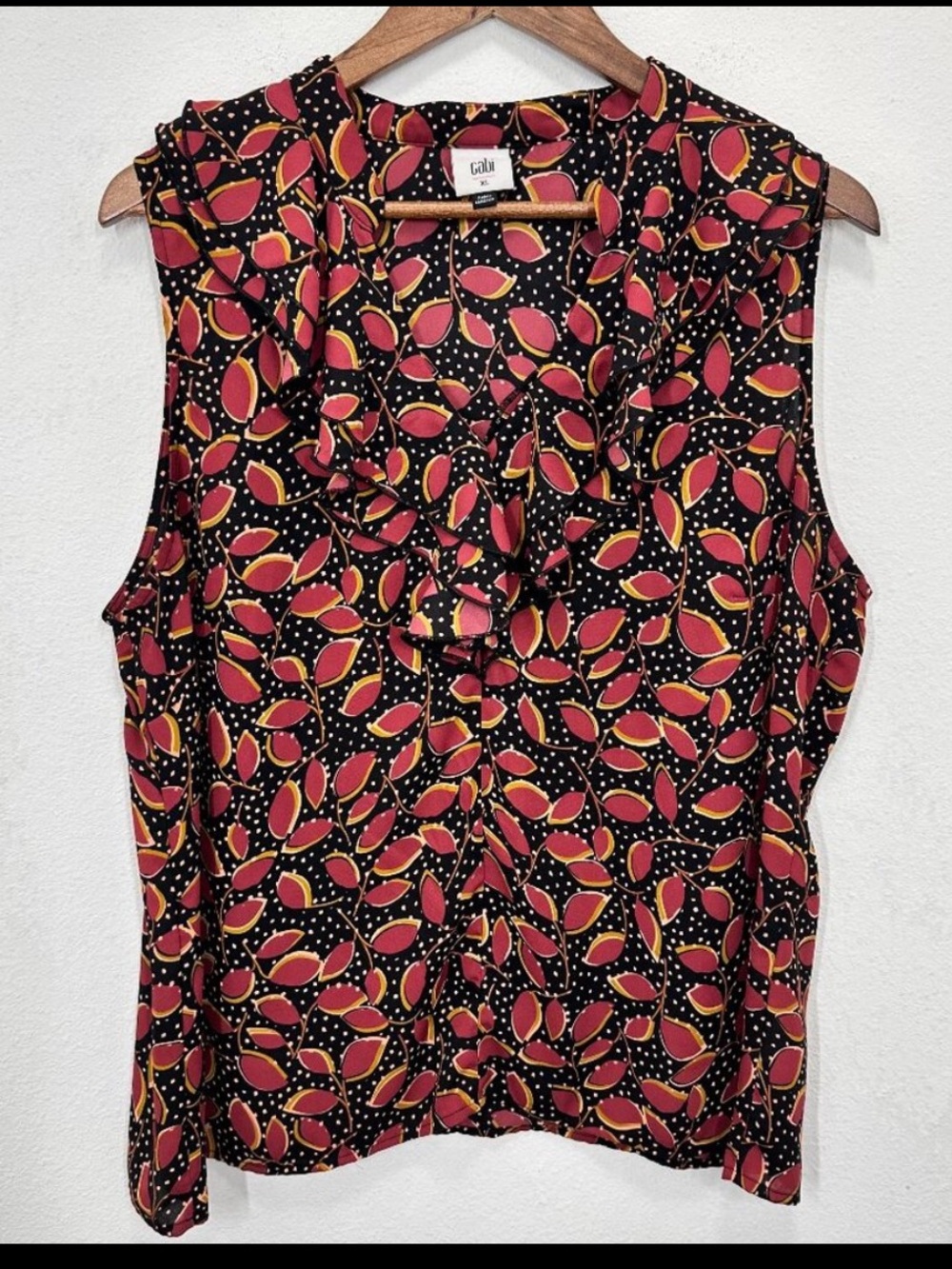 CAbi Sleeveless Ruffle Neck Shell in Black with Red and Yellow Leaf Print